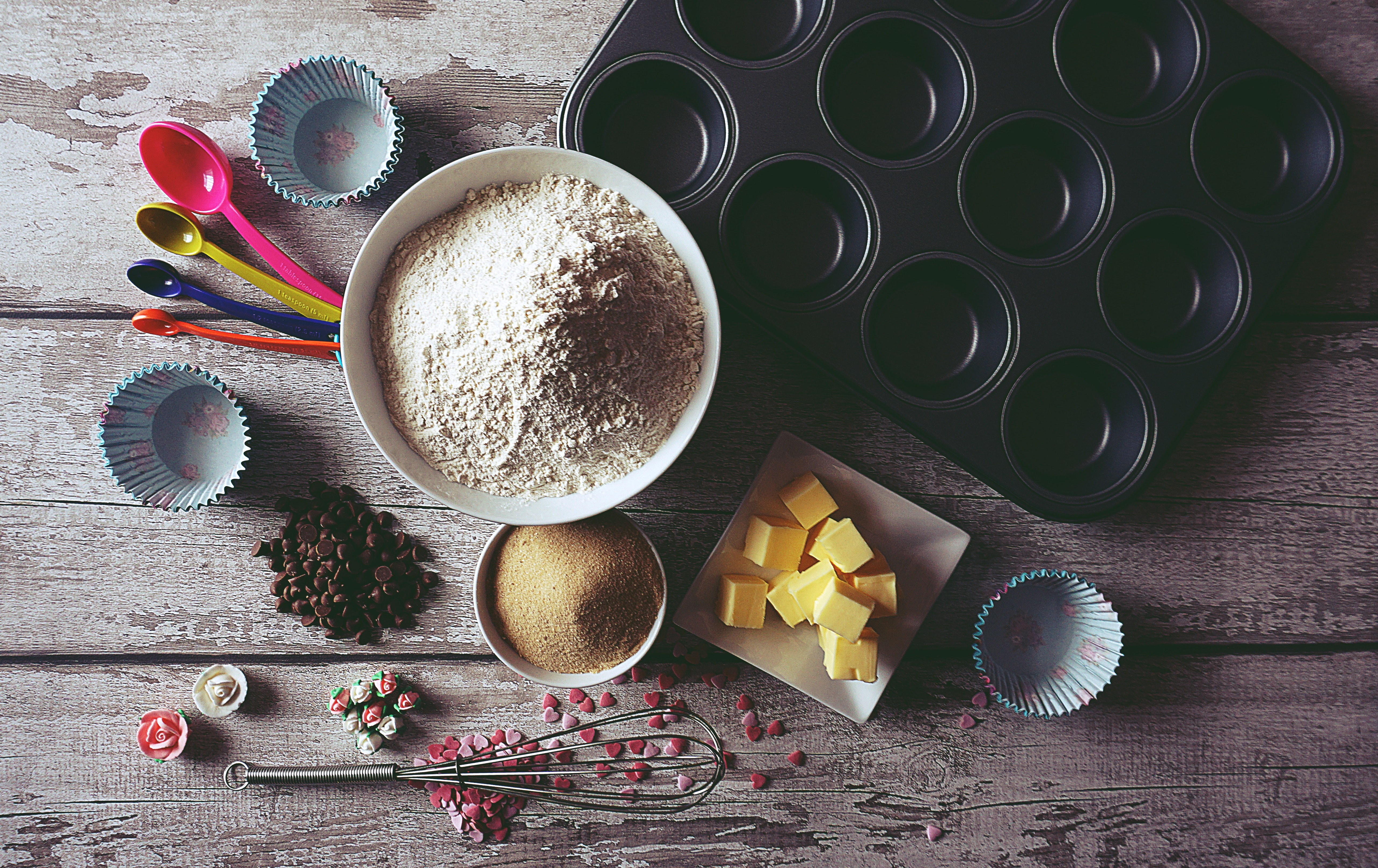 Baking ingredients arranged on a wooden table. 