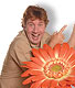 Steve Irwin look a like with giant orange flower
