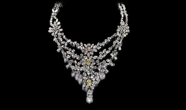 Three tiered necklace covered in diamonds 