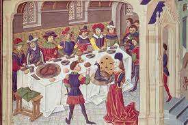 painting from the middle ages depicting men and women around a feast 