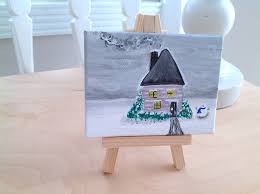 Tiny canvas on display on a kitchen table 