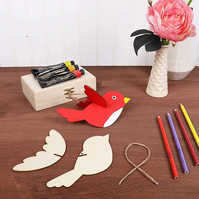 photo of painted and unpainted wooden bird ornaments 