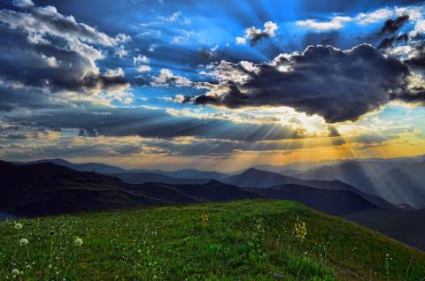 picture of hills with light coming through 