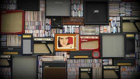 Picture of Elvis on a television amid a stack of other blank televisions 