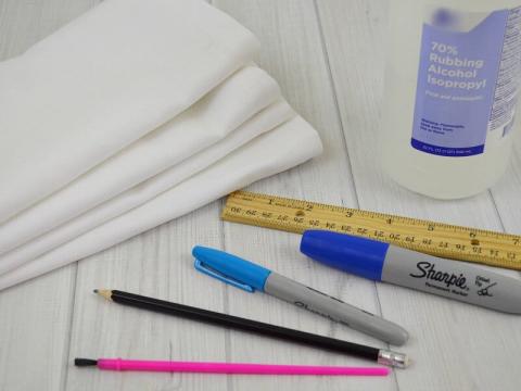 blank white napkins and art supplies for dyeing 