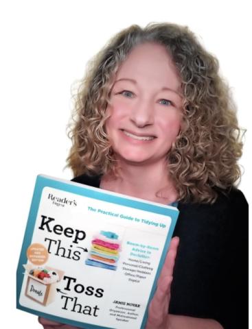 color photo of author Jamie Novak holding her book 'keep this, toss that'