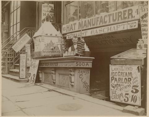 black and white photo of a soda counter outside a deli