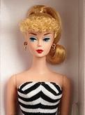 color photo of the original Barbie with her hair up in a ponytail and in a black and white striped top