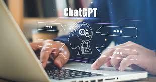 color photo of two hands typing on a laptop with white words superimposed on top of them reading 'ChatGPT' 