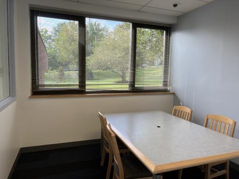small group study room with table and chairs 