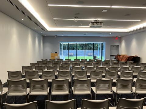 large adult meeting room with rows of chairs