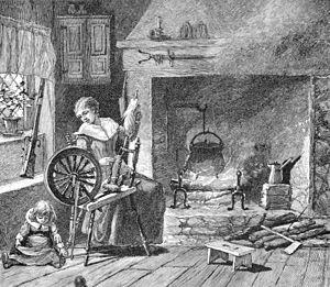 black and white illustration of a colonial woman at her spinning wheel with a small child playing nearby