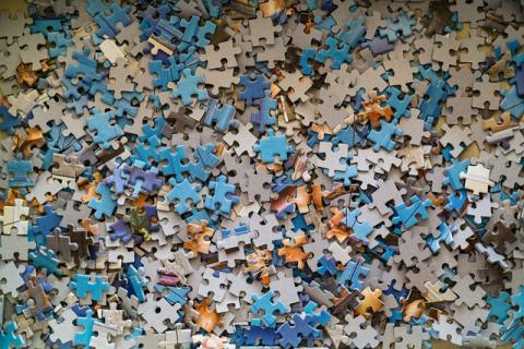 color photo of a pile of jigsaw pieces