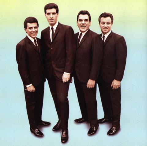 colored photo of The Four Seasons in suits against a green to blue ombre background