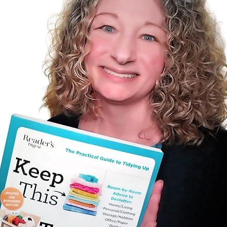 Photo of Jamie Novak holding her book 'keep this, toss that' 