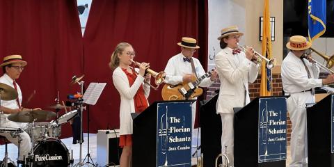 VFS  Jass performs in straw hats on a stage