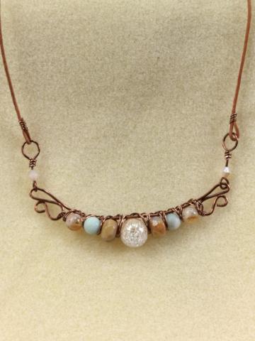 copper necklace with several beads