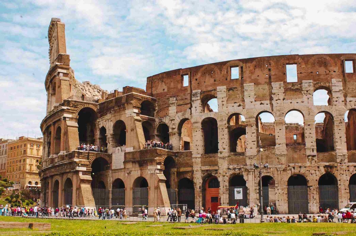 the coliseum in ruins during the day with tourists