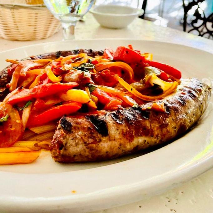 white plate with mixed vegetables and a slice of bread 