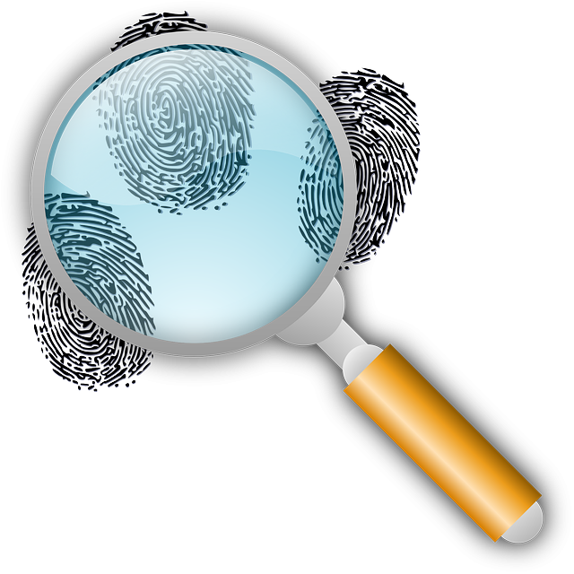 magnifying glass hovers over three fingerprints