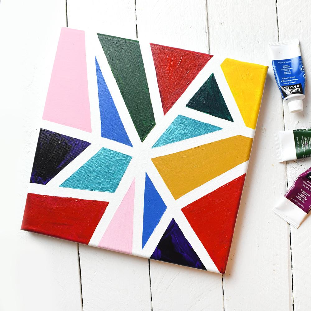 canvas painted in different brightly colored triangles