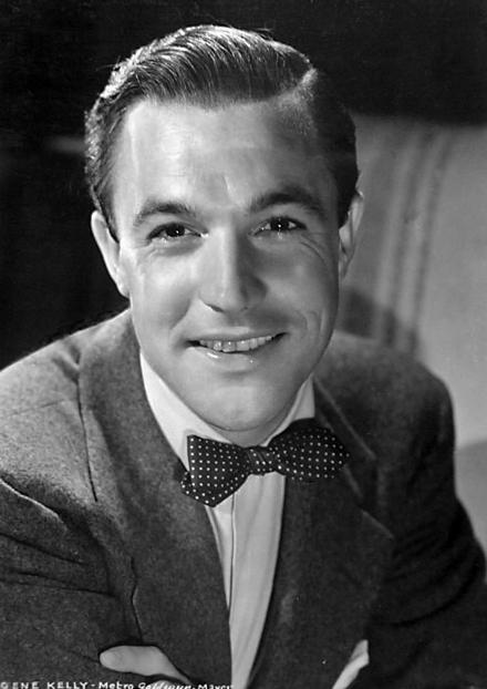 black and white photo, a portrait of Gene Kelly in a suit and bow tie 