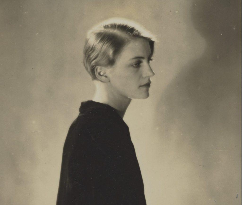 black and white photo of a woman in portrait looking off to the side. 