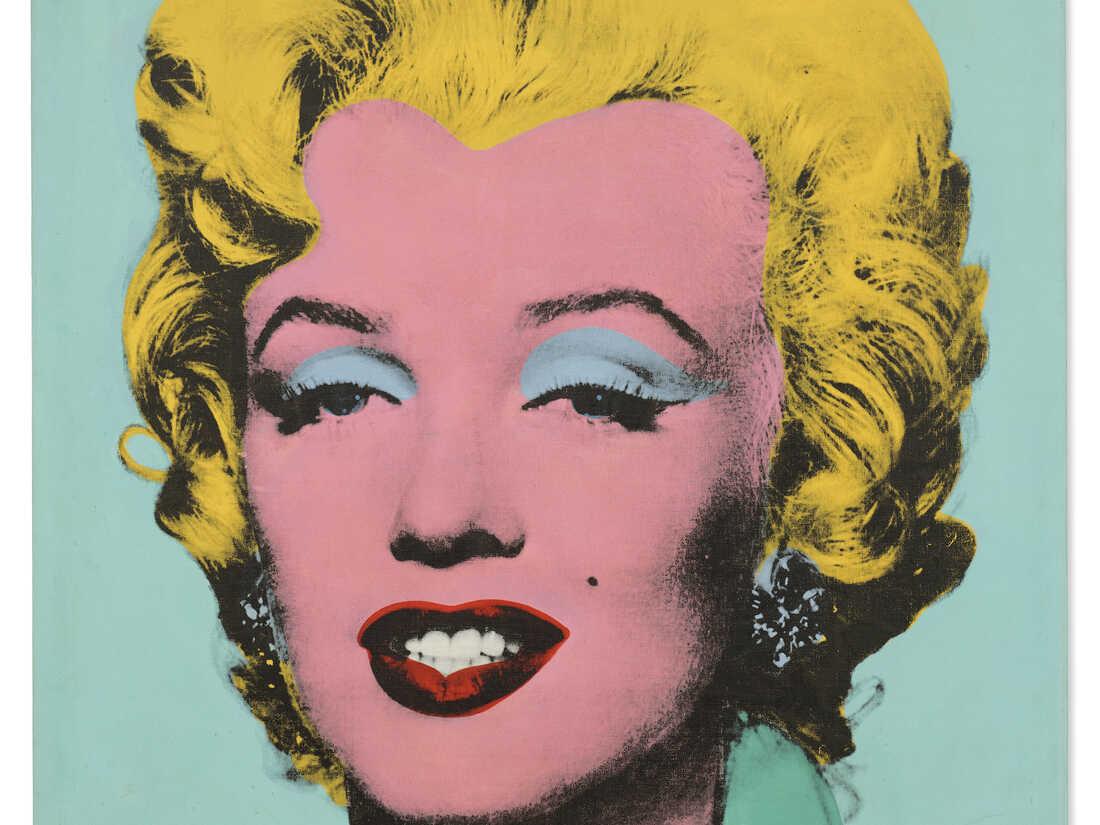 a picture of Marilyn Monroe that has been recolored in brights and neons by the artist Andy Warhol 