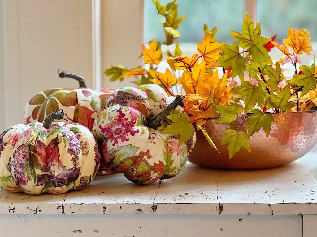 color photo of three foam pumpkins decorated with cheery fall themed napkins