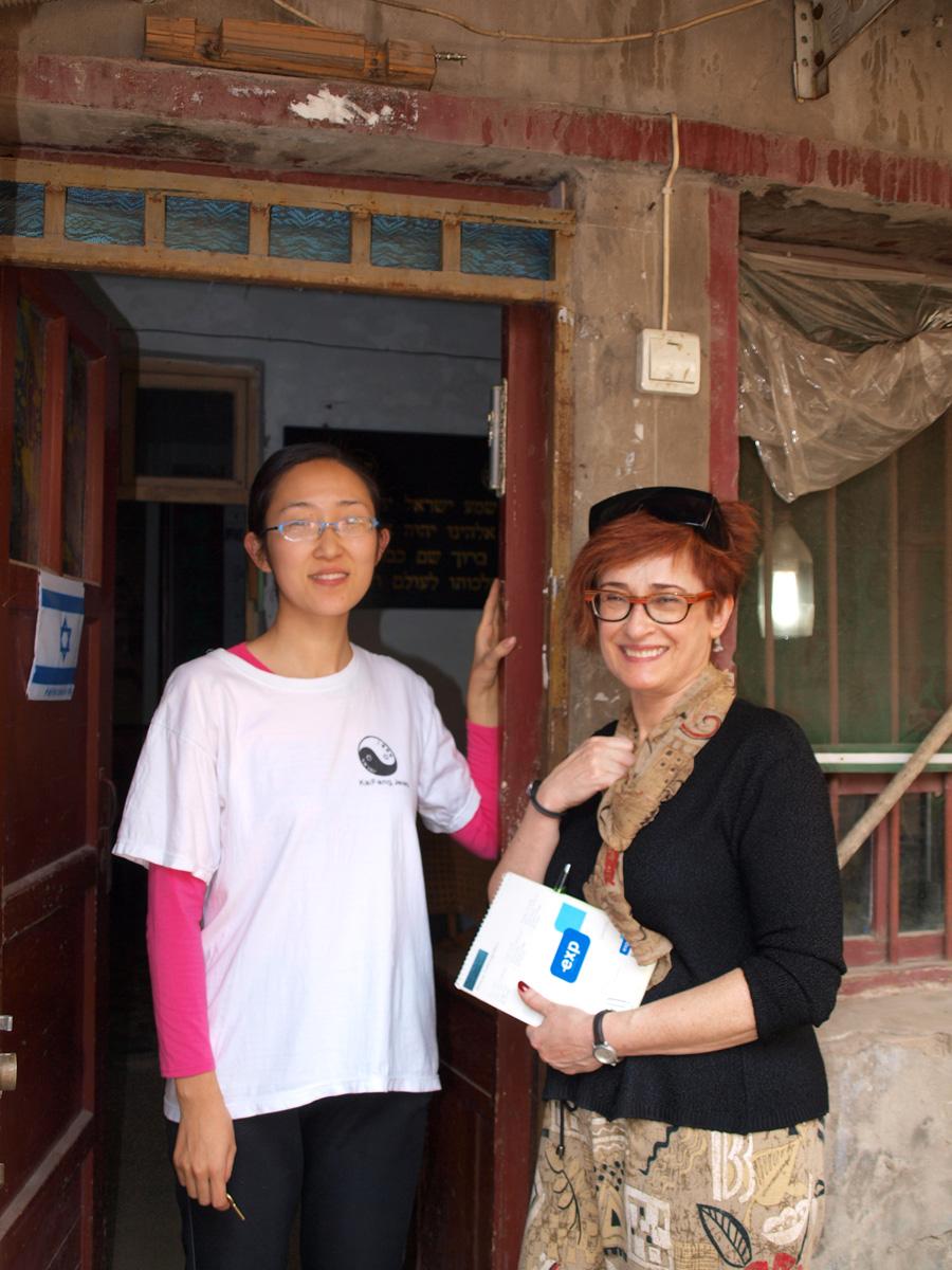 color photo of two people in a doorway