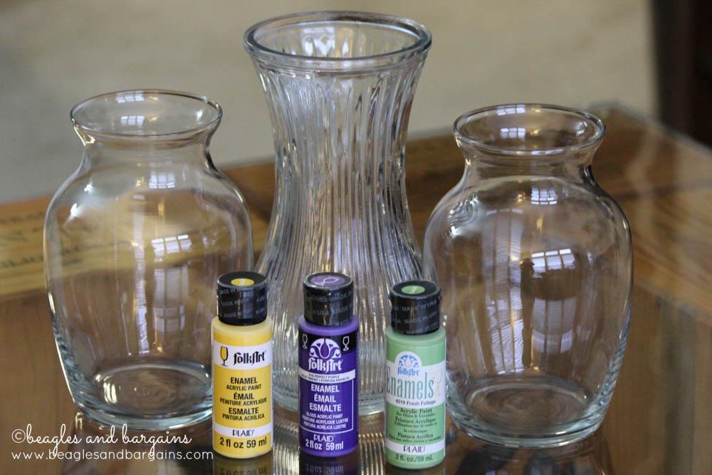 color photo of three glass vases and three containers of glass paint