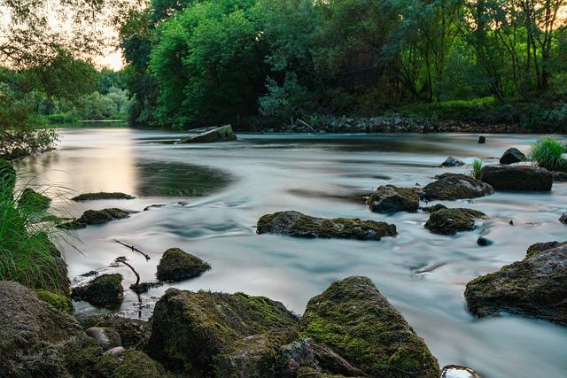 color photograph of a creek flowing over rocks 