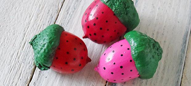 Acorns painted to look like strawberries. 